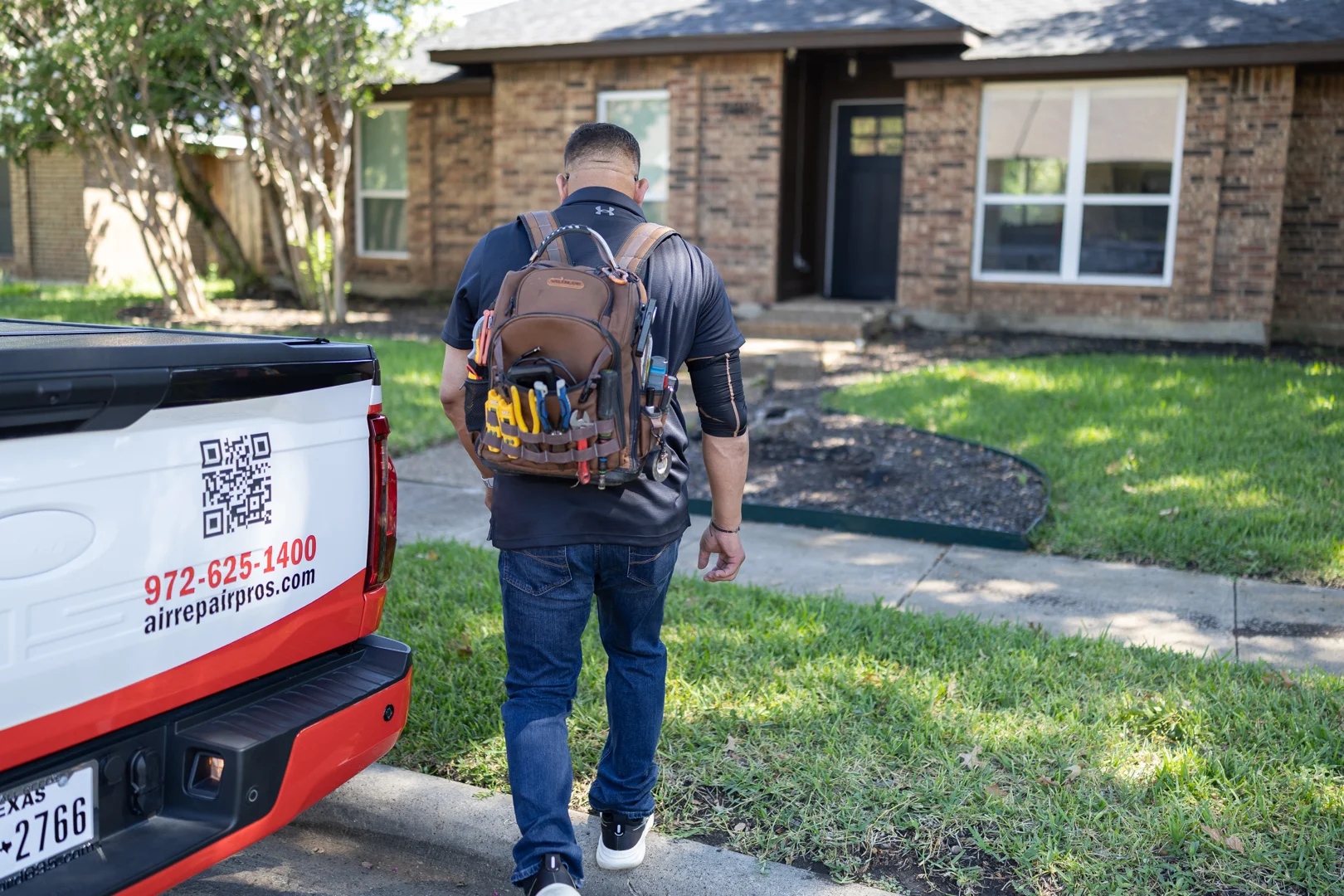Air Repair Pros HVAC technician arriving for AC repair service at a McKinney, TX home